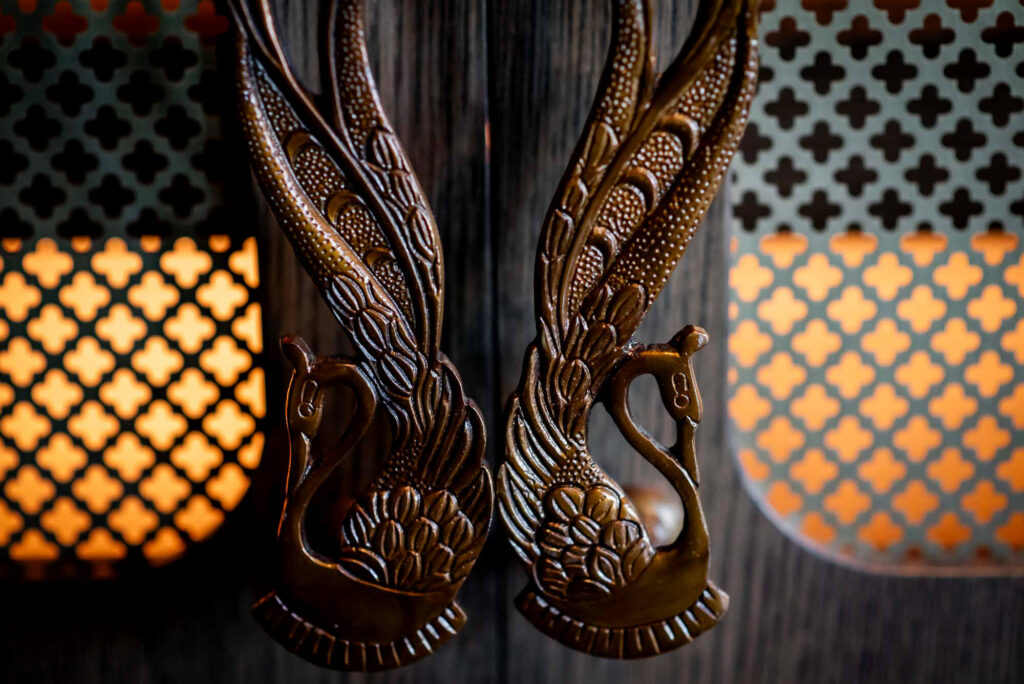 Close up of ornate door handles at La Plume in Toronto